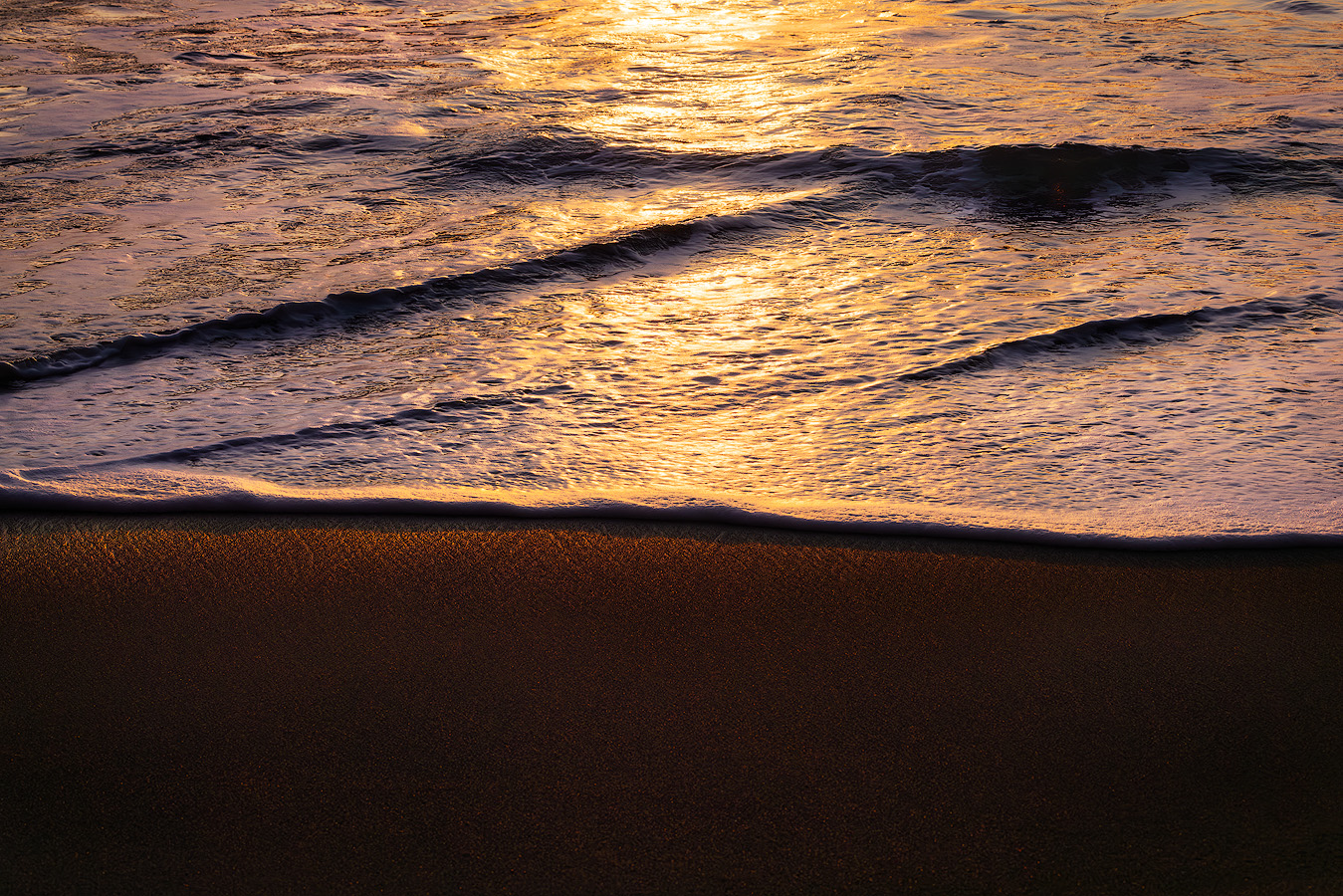 Sunset reflections on incoming surf at Secret Beach on the Oregon Coast captured at ISO 100 for maximum dynamic range