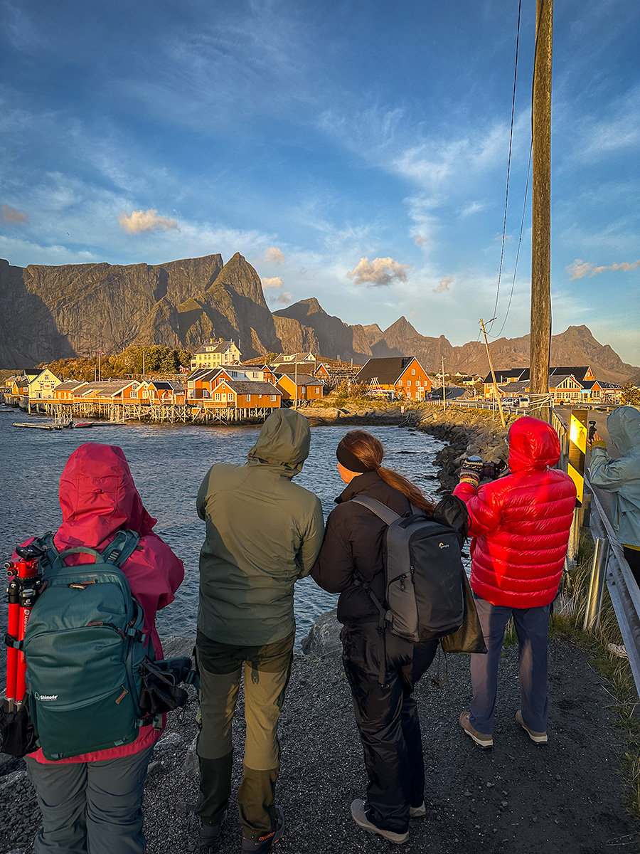 Group of photographers photographing the landscape of Norway in the village of Reine