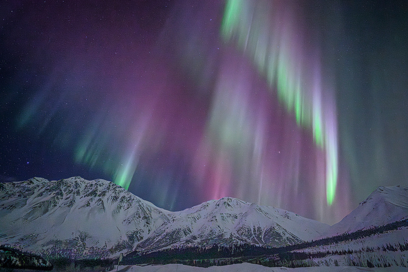 KP 7 aurora storm with pink and green columns over the Eastern Alaska Range on the first night of Workshop Two