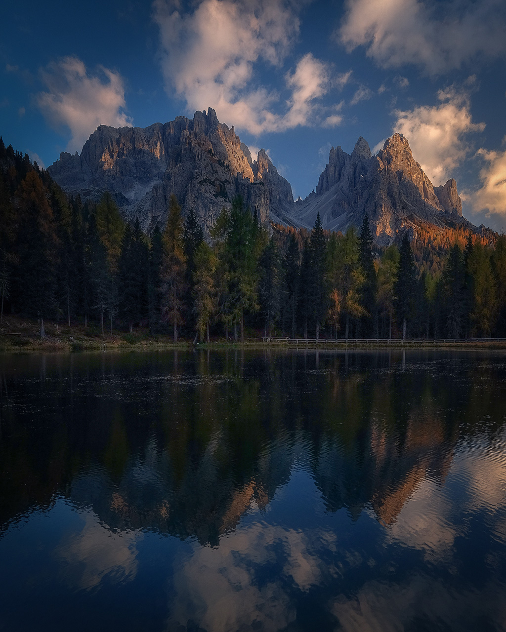 Lago d'Antorno blue hour reflection of Italian Dolomites peaks and autumn forest October photography