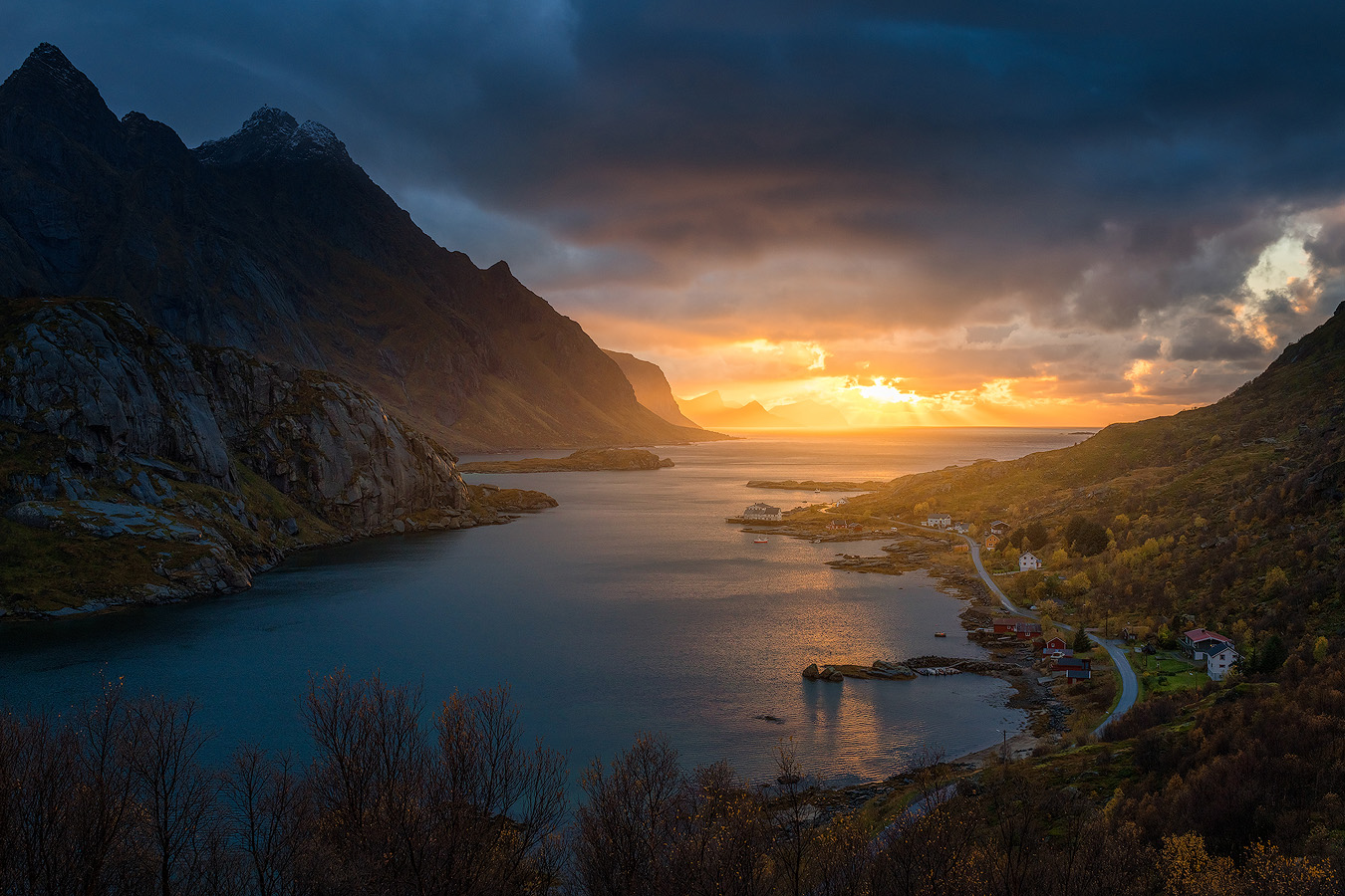 Sunset over Mærvoll fjord on Vestvågøy in central Lofoten with storm light and autumn color