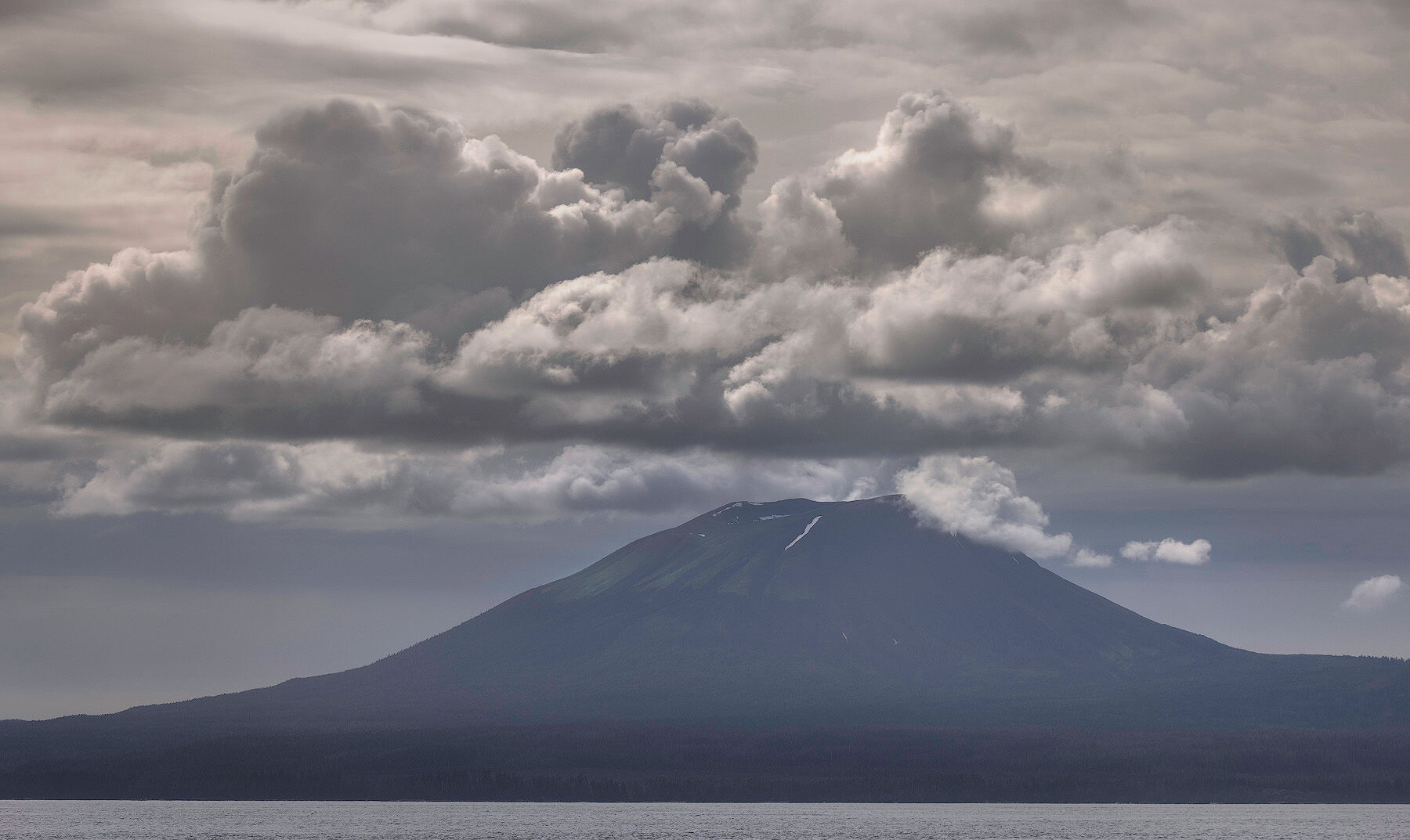 Mount Edgecumbe under building clouds across Sitka Sound, Alaska