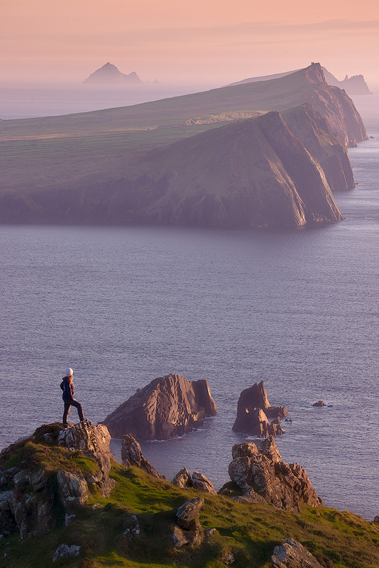 Telephoto lens compression effect making distant mountains appear larger and closer to foreground in landscape photograph